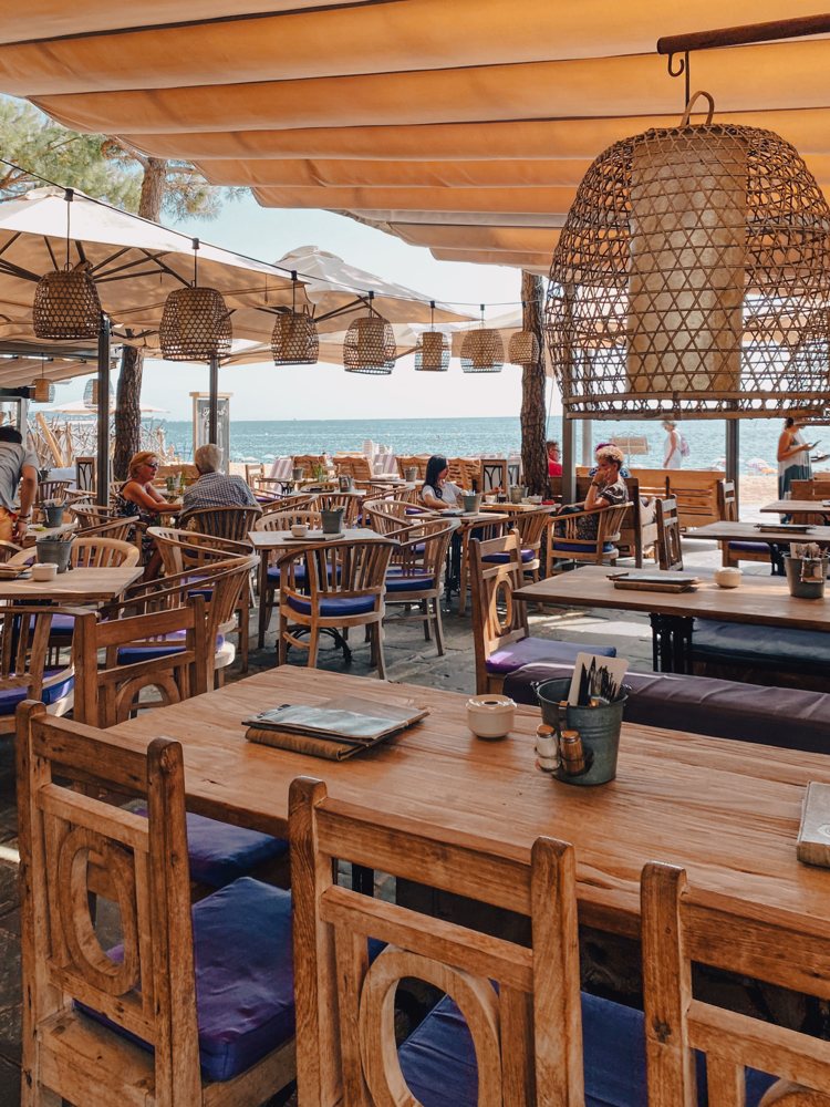 Restaurant patio with wooden tables